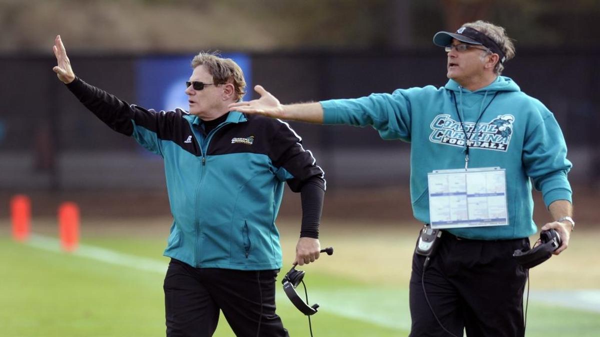 Coastal Carolina coach Joe Moglia (left) stands with former offensive coordinator Dave Patenaude, who has recently taken the same position at Temple.