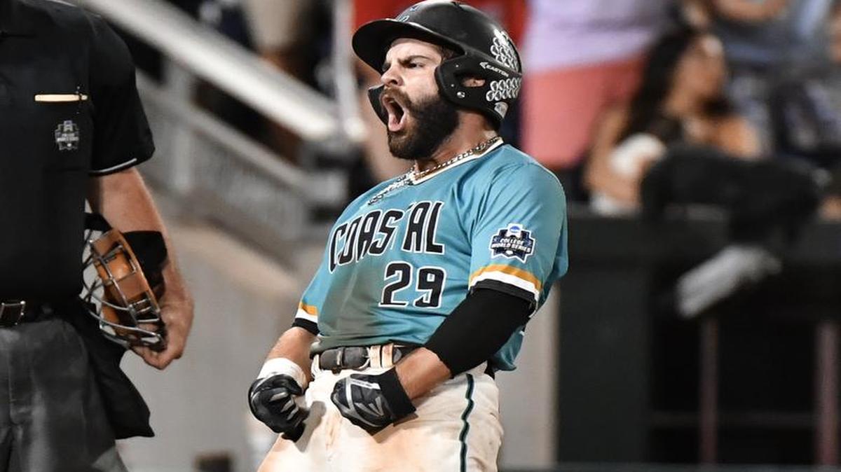 Coastal Carolina's Anthony Marks reacts to scoring on a Connor Owings single against Arizona in the eighth inning in Game 2 of the NCAA Men's College World Series finals baseball game in Omaha, Neb., Tuesday, June 28, 2016.