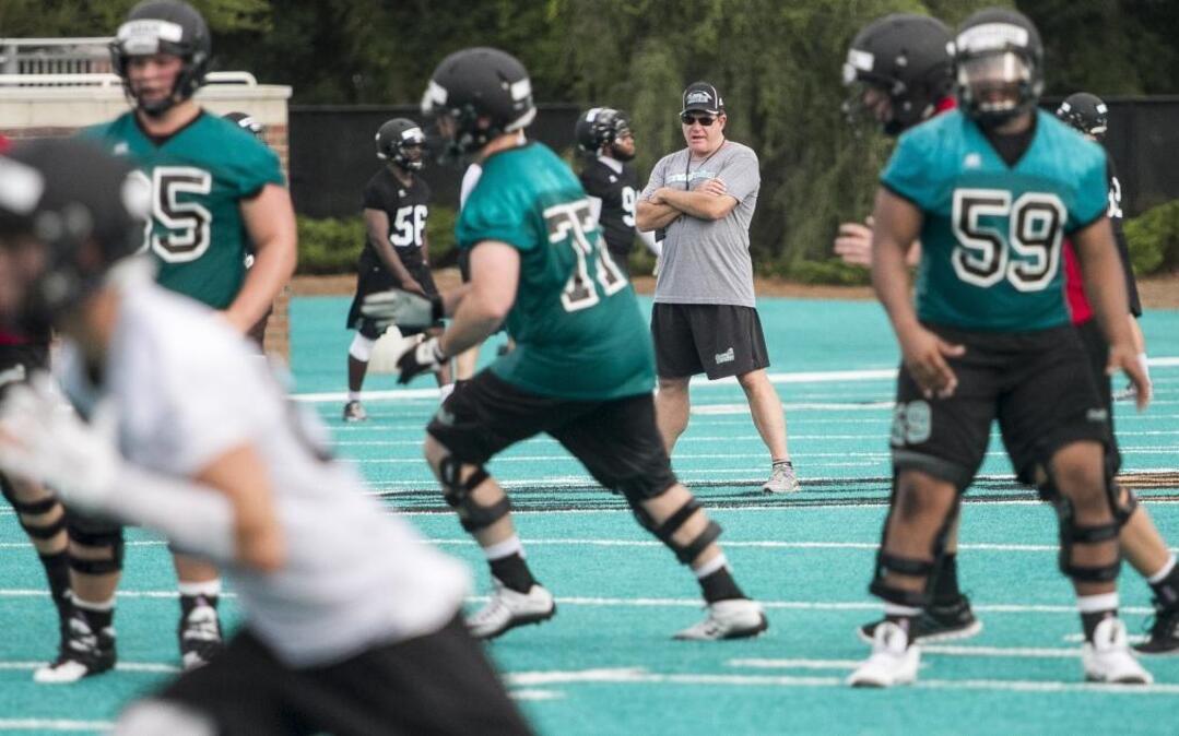 
Coastal Carolina coach Joe Moglia watches his players during a recent practice.
