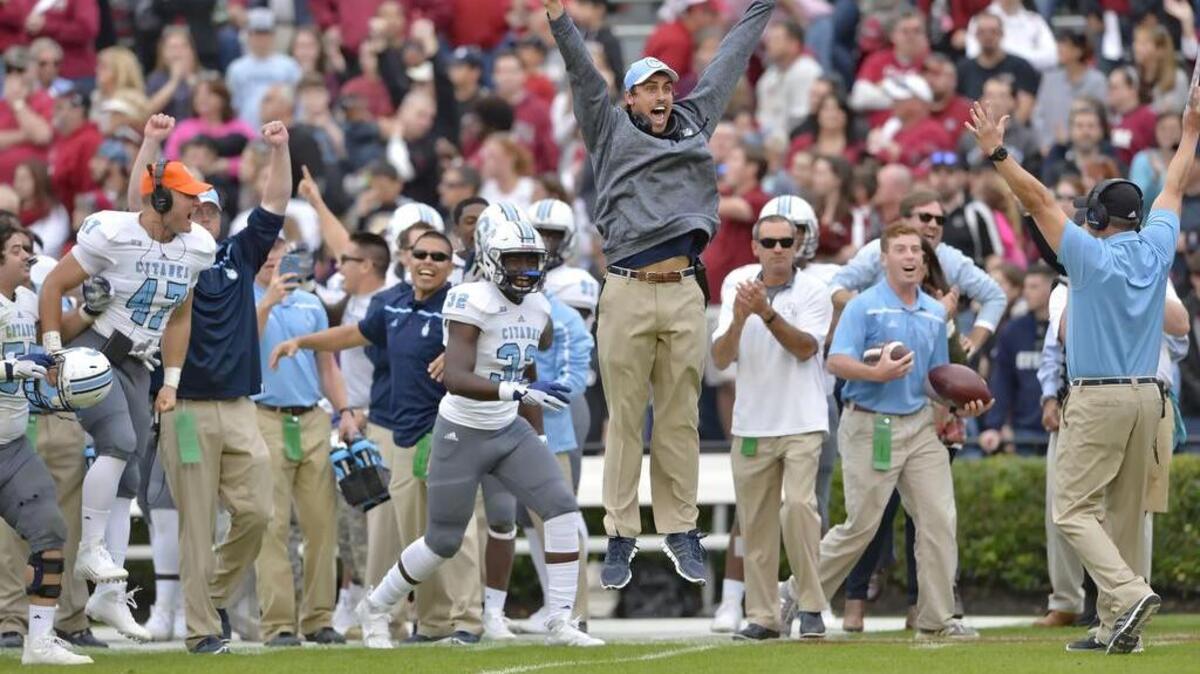 The Citadel's bench erupts in celebration during the final seconds of a win over South Carolina.