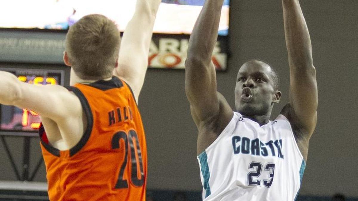 CCU’s Badou Diagne puts a shot up over Mercer’s Cory Kilby during Tuesday’s game.
