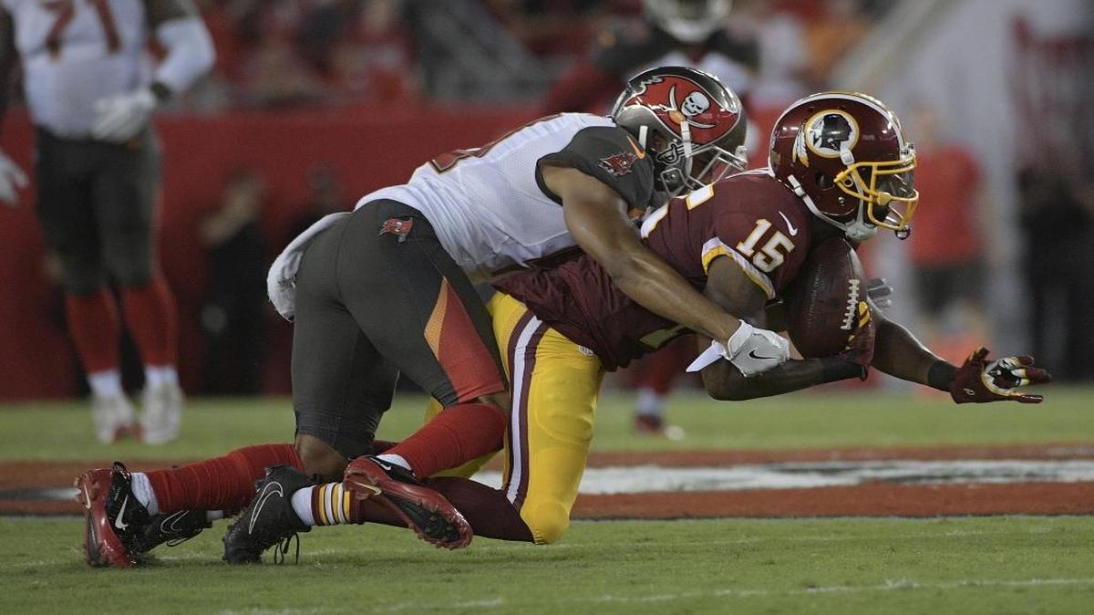 Then-Washington Redskins receiver Matt Hazel is tackled by Tampa Bay cornerback Jonathan Moxey during a preseason game. Hazel was cut by the Redskins and now is a member of the Indianapolis Colts.