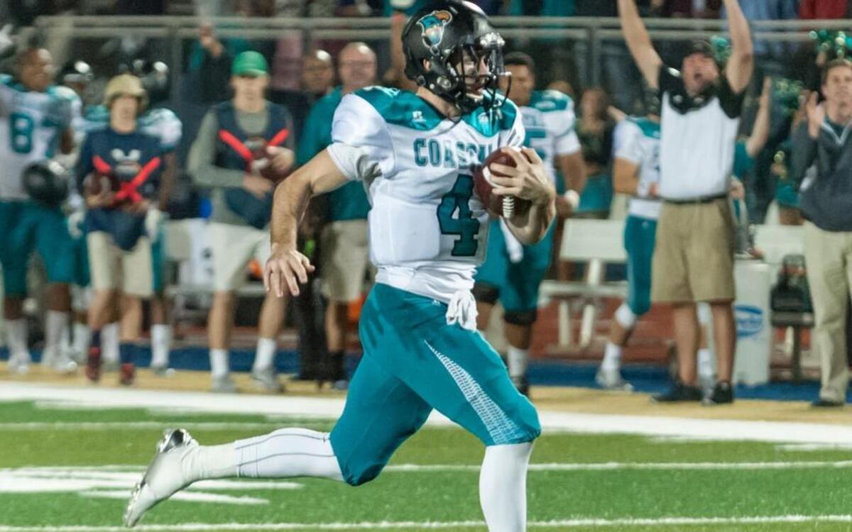 Coastal Carolina quarterback Alex Ross scores a touchdown against Charleston Southern on Saturday.