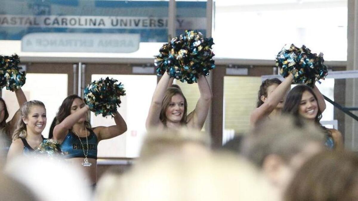 
Cheerleaders cheer as Coastal Carolina University announced they would join the Sun Belt Conference.
