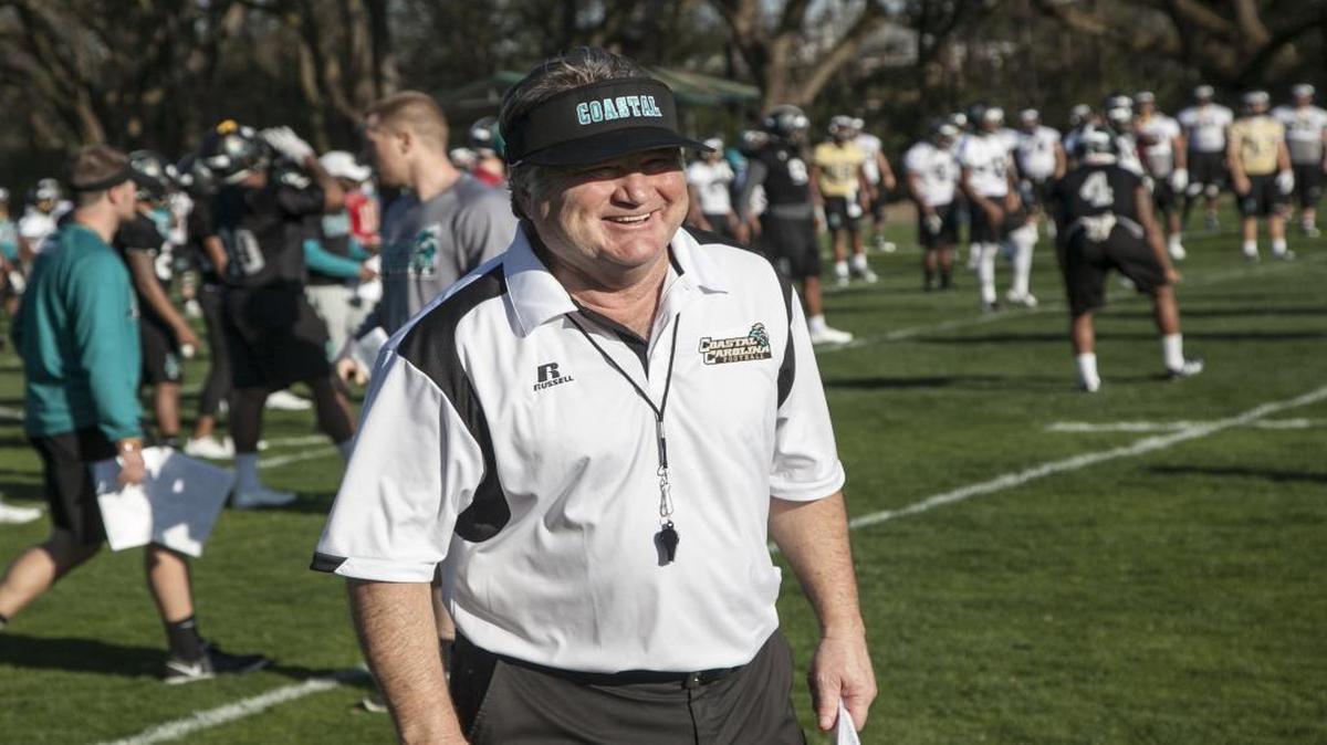 Coastal Carolina’s new defensive coordinator, Mickey Matthews cracks a smile during the first practice of the spring drills.
