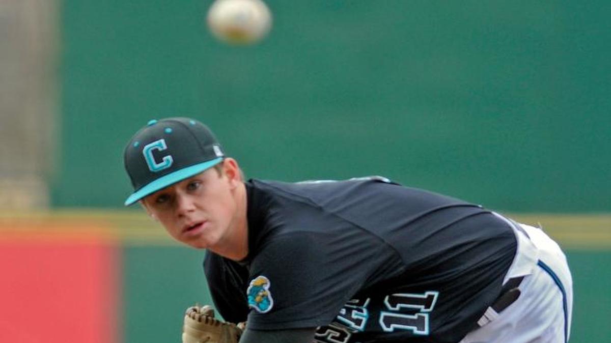 
Coastal Carolina starting pitcher Ben Smith throws in the 1st inning of their Caravelle Resort Baseball at the Beach game with Indiana in 2013.
