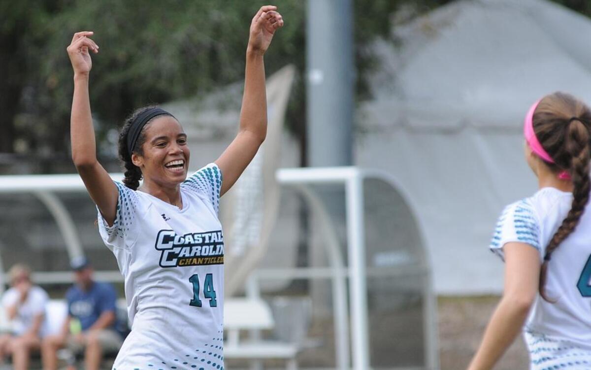Coastal Carolina’s Amber Adams celebrates a goal with teammate Kayla Christian against Charleston Southern in the first round of the Big South Tournament.