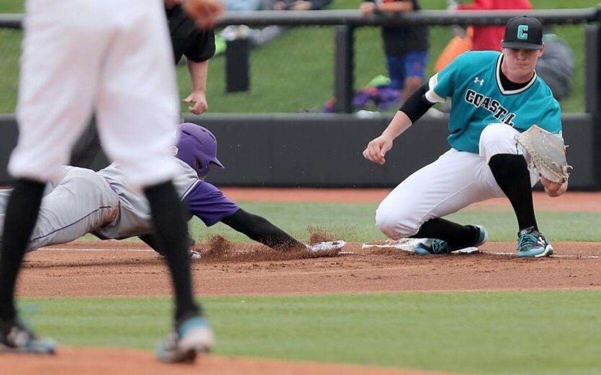 Coastal Carolina’s Kevin Woodall Jr. secures the ball following a pickoff attempt during a recent game.