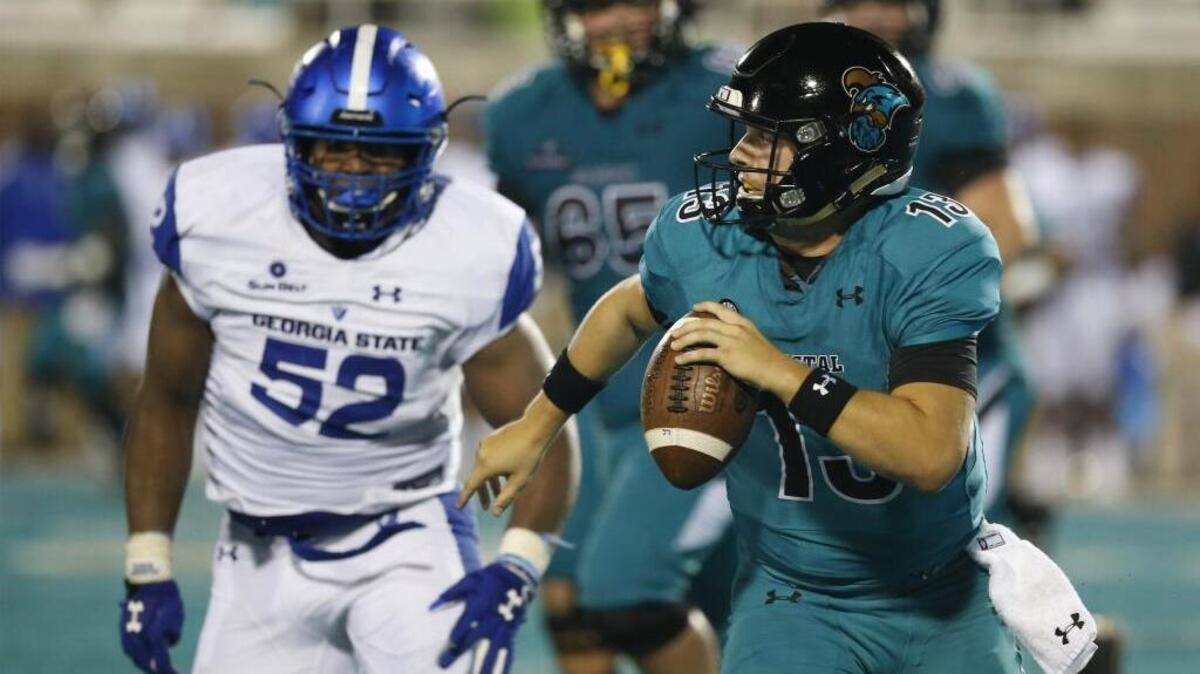 Coastal Carolina quarterback Tyler Keane (13) looks to pass against Georgia State during the 2017 season. Keane has been hired as an intern by the Buffalo Bills in the NFL team's analytics department.