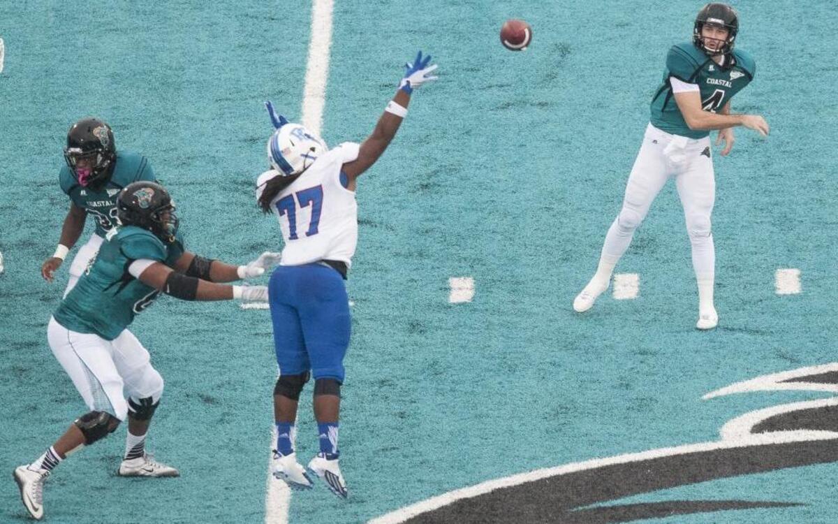 Coastal Carolina’s Alex Ross (right) is playing through and ankle injury.