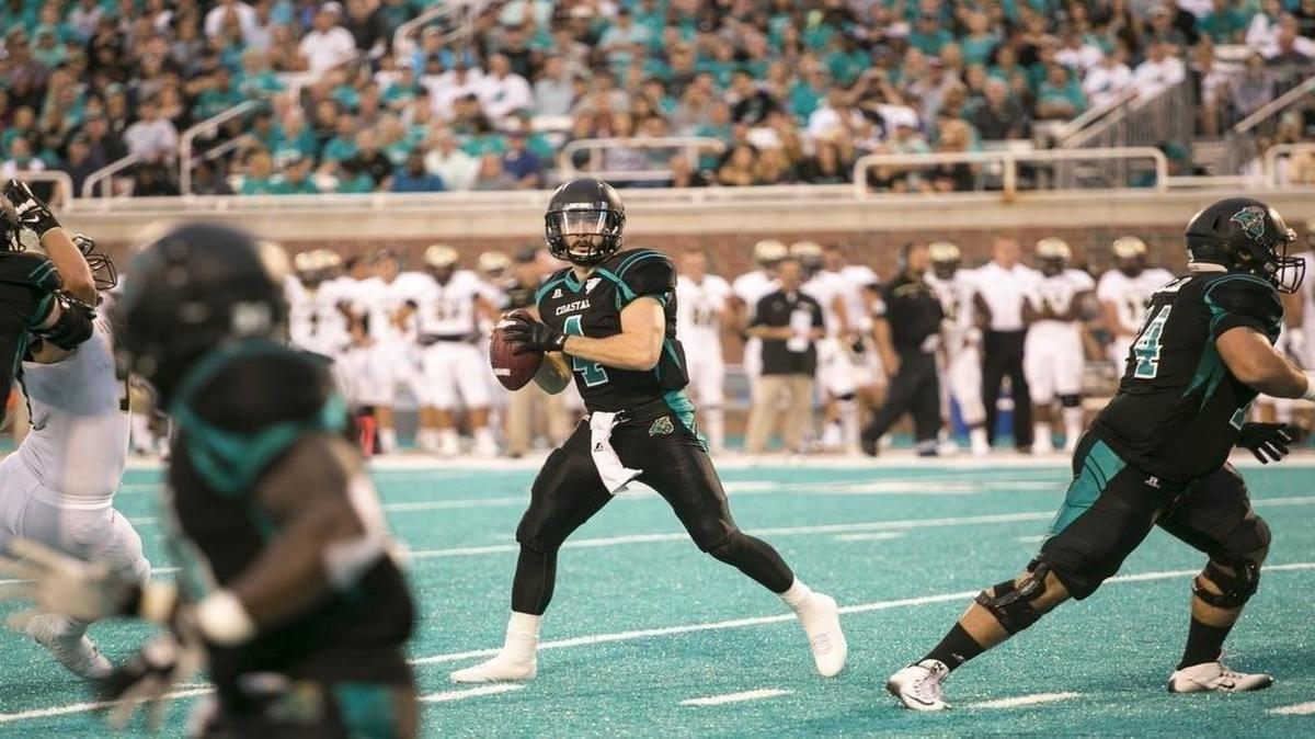 
Coastal Carolina quarterback Alex Ross looks for a receiver during last week’s win over Bryant.
