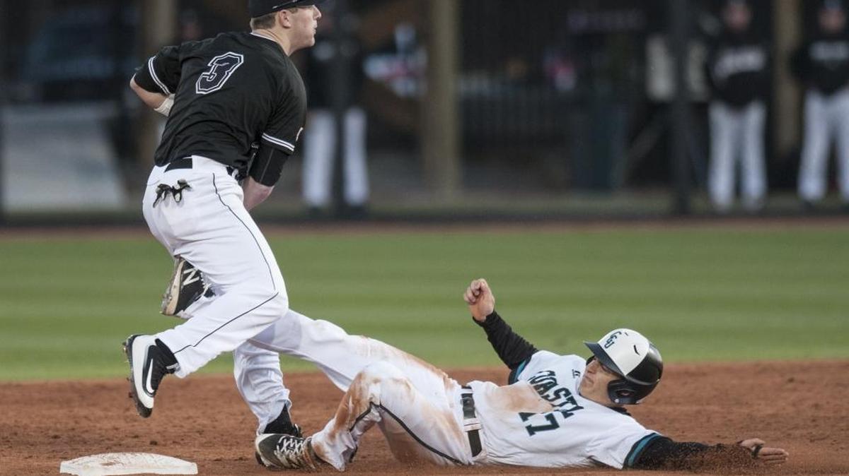 Coastal Carolina’s Billy Cooke (right) has proven to be one of the team’s biggest surprises, picking up more hits in a weekend than he had the previous season.