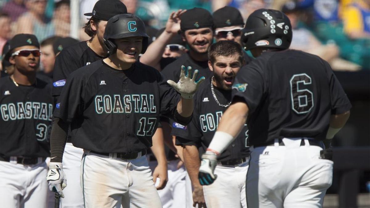 Coastal Carolina teammates celebrate with Connor Owings after a home run earlier this season. Owings has been one of the Chanticleers best hitters of late, currently possessing a 13-game hit streak.