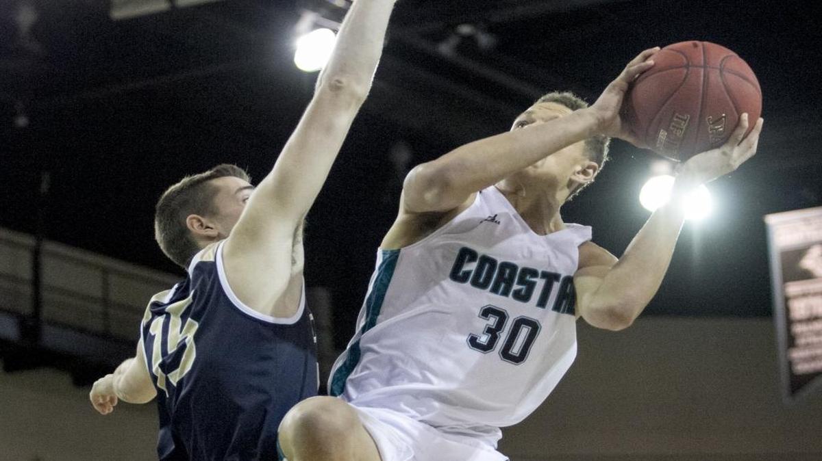 Coastal Carolina’s Colton Ray-St Cyr attempts a shot during a game last season. The Chanticleer men’s basketball season begins Friday night.