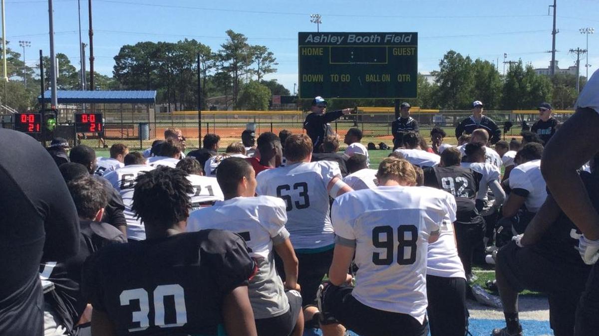 Coastal Carolina head football coach Joe Moglia speaks with his team following their practice at Ashley Booth Field at Myrtle Beach High School on Tuesday as the Coastal Carolina campus was closed until Wednesday.