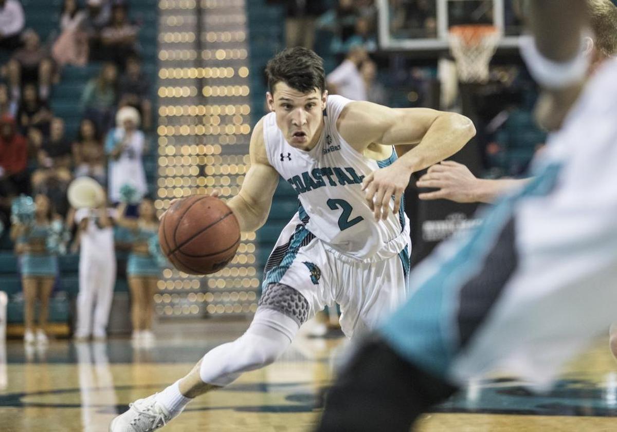 Then with Coastal Carolina, Artur Labinowicz drives up the court against Wofford during a November 2017 game.