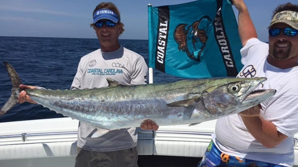 Professor Joe Winslow and Austin Keener show off the winning 44.07-pound king in the 37th Annual East Coast Got Em On King Mackerel Tournament out of Carolina Beach, N.C.