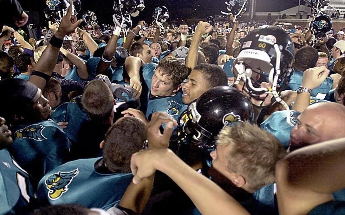 
Coastal Carolina football players celebrate winning the first game in school history as they defeated Newberry in 2003. The school announced Tuesday the team will join the FBS Sun Belt Conference.
