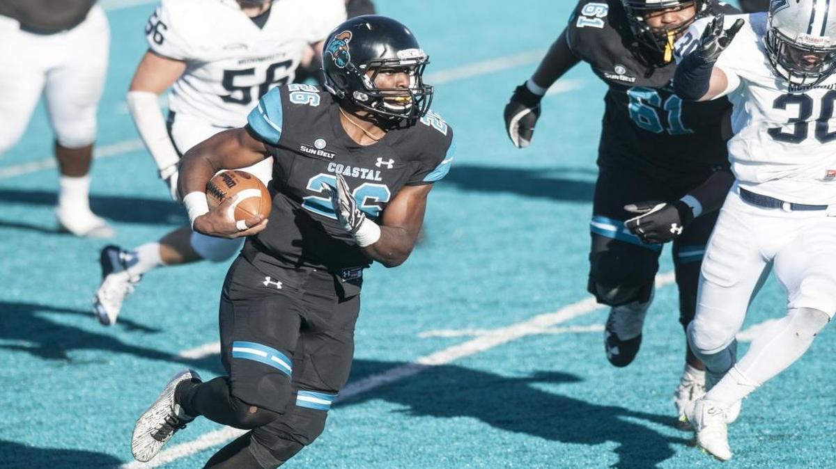 Coastal Carolina’s Ryan Lee looks for running room against Monmouth on Saturday.