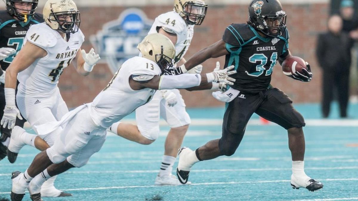 
Coastal Carolina’s De’Angelo Henderson breaks free for a career-long 59 yard run against Bryant on Saturday.
