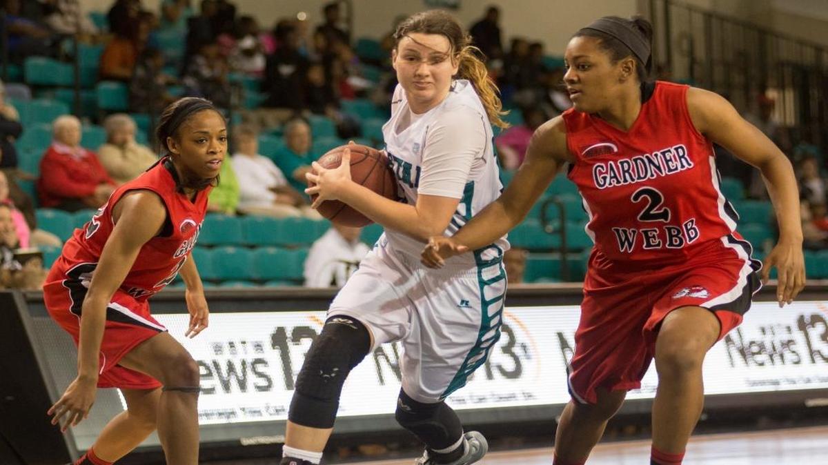 Coastal Carolina’s Kennedy Archer (center) drives the ball while being defended by Gardner-Webb’s Kiera Currie.