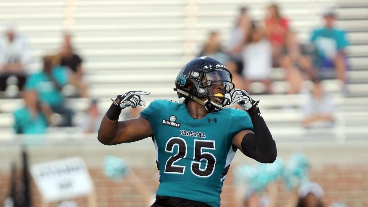 Coastal Carolina’s Anthony McAfee celebrates during the Chanticleers’ 38-28 win over Massachusetts in the 2018 season opener.