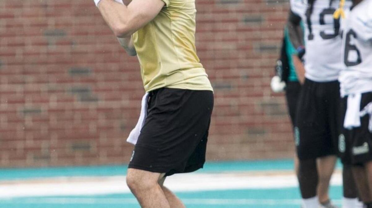 
Coastal Carolina Alex Ross looks to pass during the first day of practice.
