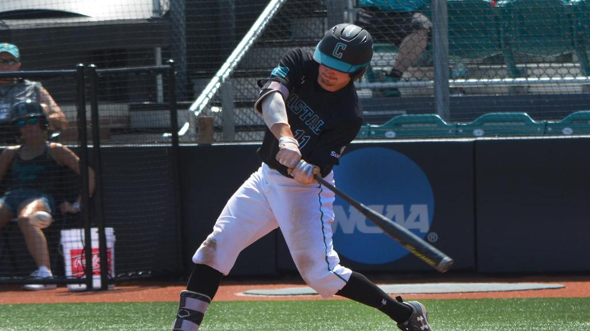 Jordan Gore swings at a pitch against Troy on Saturday at Springs Brooks Stadium in Conway.