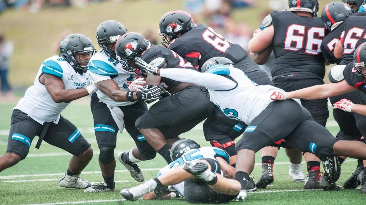 The Coastal Carolina defense swarms Gardner-Webb last Saturday.