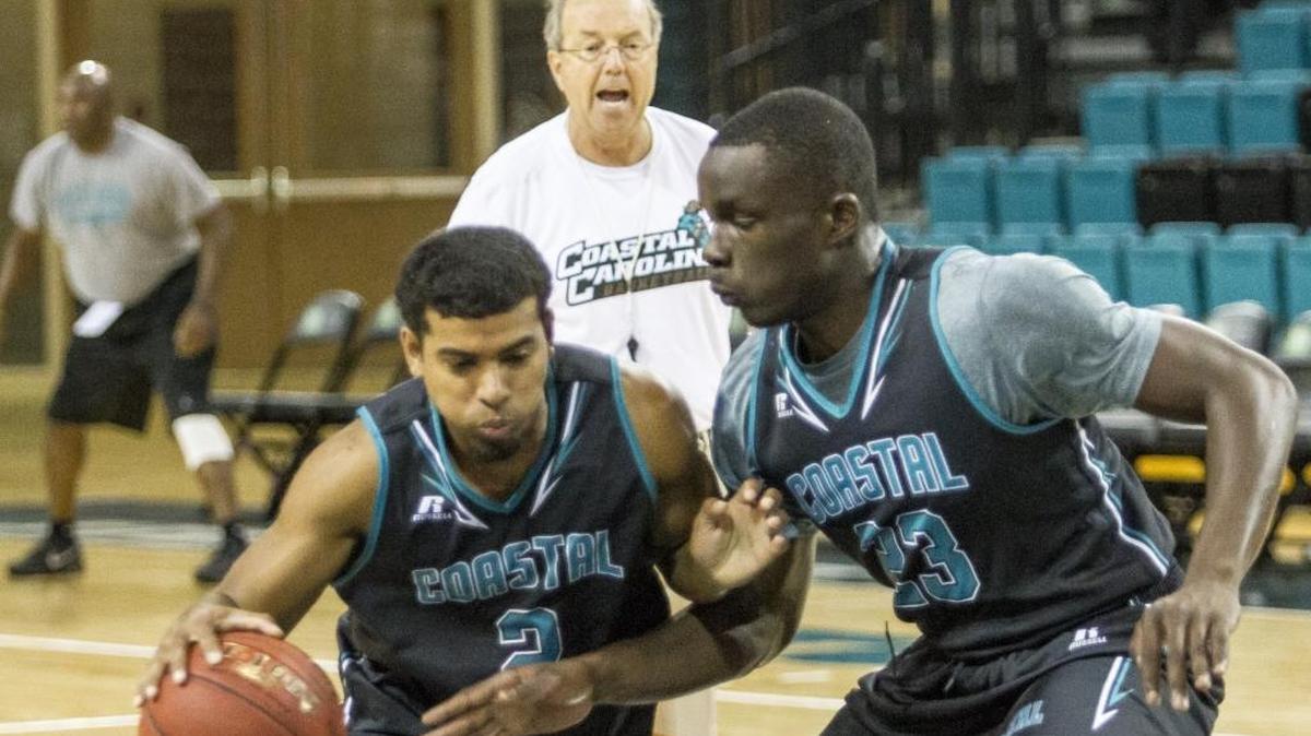 Coastal Carolina head basketball coach Cliff Ellis barks commands at players during a practice earlier this season. His ability to pull a few strings has given the Chants a huge home date against Auburn Wednesday night.