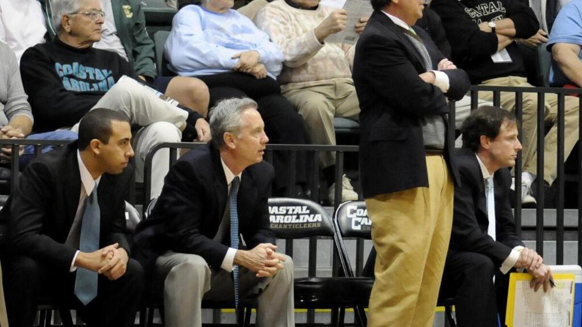 
Coastal Carolina head basketball coach Cliff Ellis (standing) and assistant coach Don Hogan look on in a game against High Point. Hogan is resigning to take a position as a high school athletics director in Florida. 
