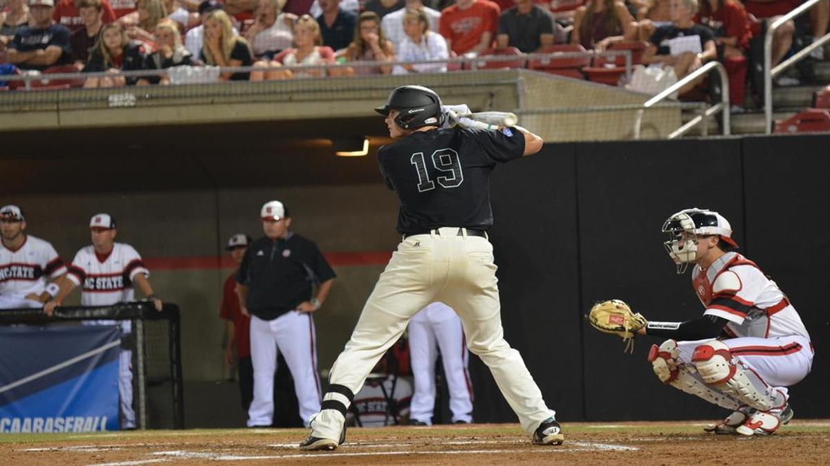 Coastal Carolina’s Kevin Woodall eyes a pitch during Saturday’s game against N.C. State.