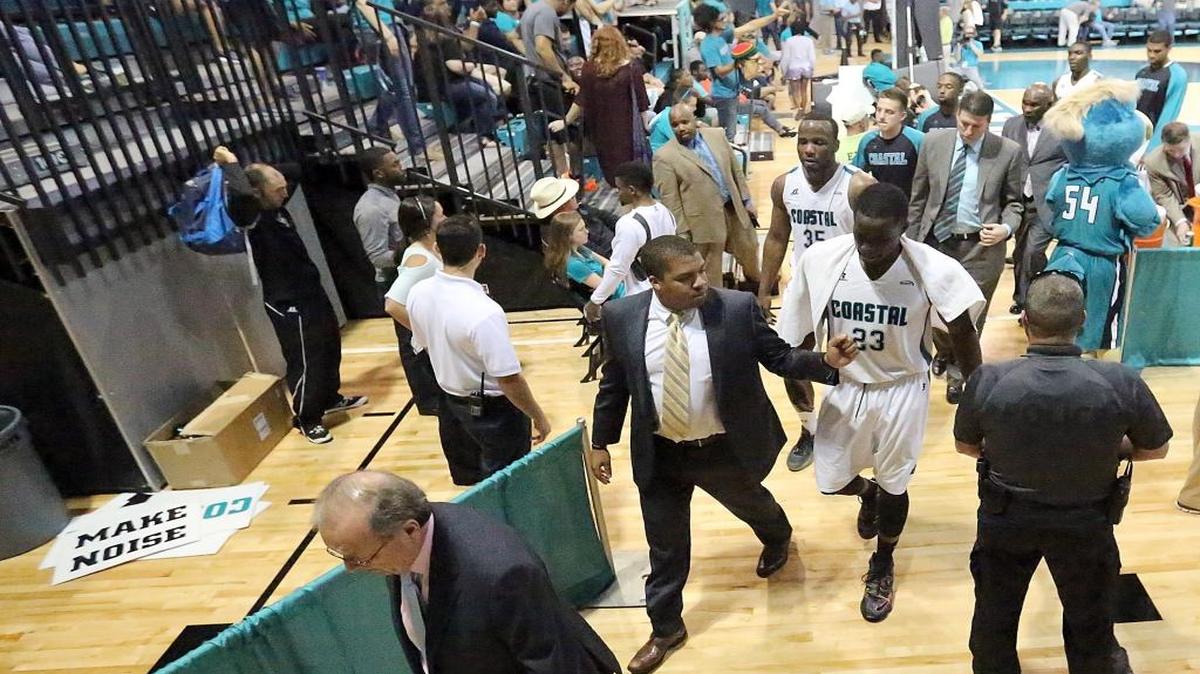 Coastal Carolina University basketball coach Cliff Ellis leads his team off the court at halftime during a game earlier this season.