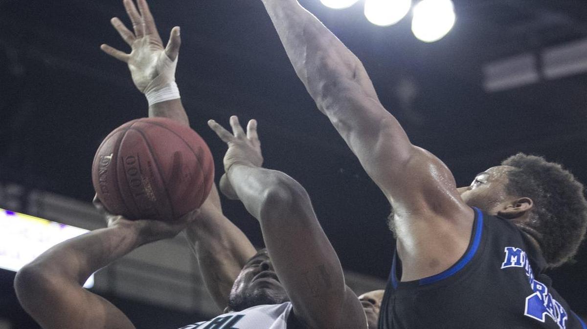 Coastal Carolina’s Marcus Freeman battles Presbyterian's DeSean Murray during a recent game. The Chants take on Big South rival Charleston Southern on Saturday.