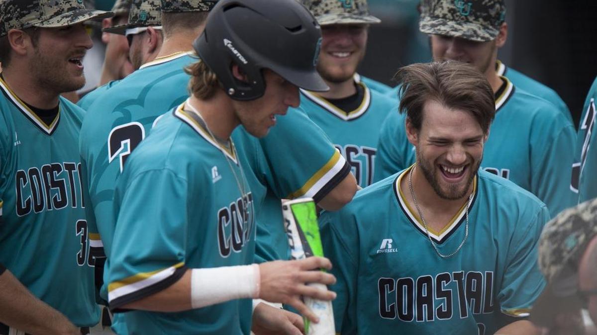 Coastal Carolina's Tyler Chadwick (right) celebrates with teammates after hitting a grand slam homer against Stetson earlier this season.
