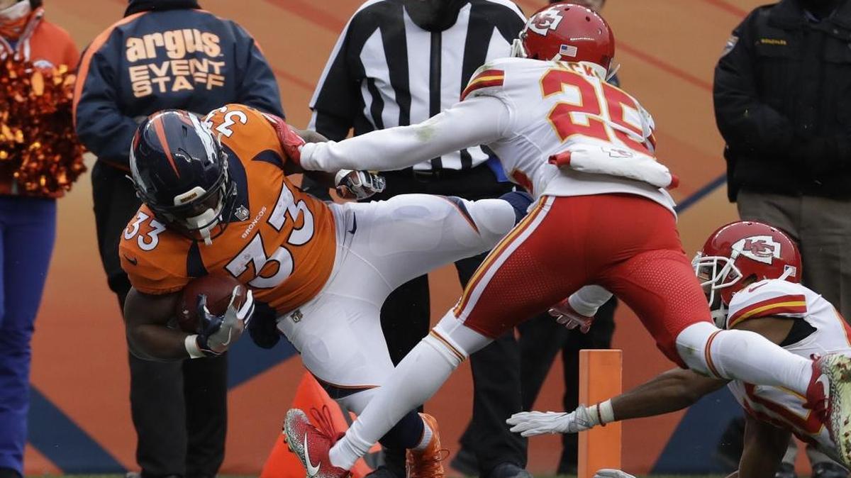 Denver Broncos running back De’Angelo Henderson (33) jumps into the end zone for a touchdown in the second quarter of Denver's final game of the 2017 season on Dec. 31 against the Kansas City Chiefs. It was the former Coastal Carolina standout’s first career touchdown.