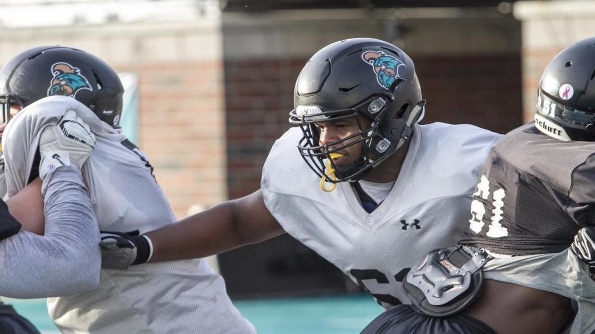 Senior left tackle Voghens Larrieux opens up some space along the Coastal Carolina offensive line during practice earlier this week.