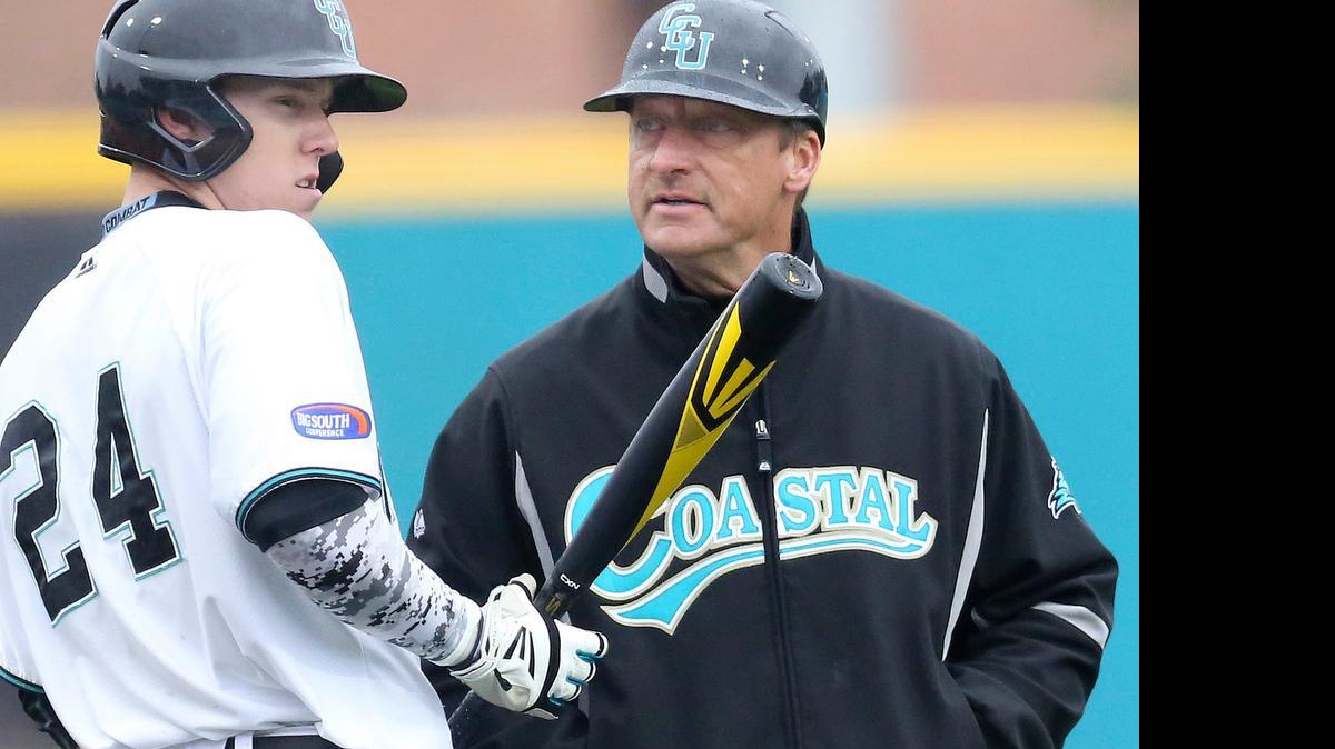 
Coastal Carolina's Dalton Ewing talks with coach Gary Gilmore before a game against Georgia Tech in February.

