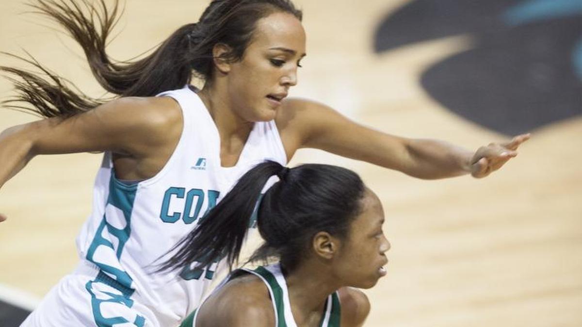 Coastal Carolina's Stephanie Isaacs (23) chases Warren Wilson's Danasia Dumas (10) along the sideline during 1st period action Wednesday evening at The HTC Center in Conway. Coastal defeated the Owls 100-49.