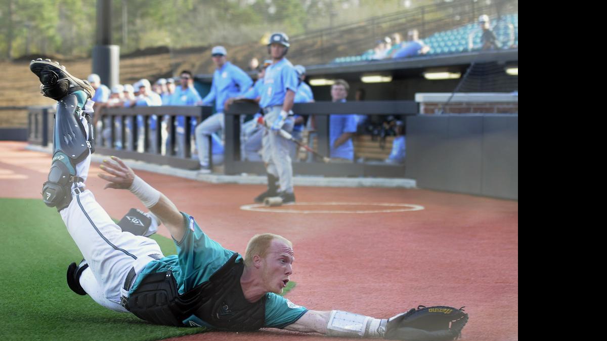 
Coastal Carolina catcher Casey Schroeder makes a diving attempt at a foul ball.
