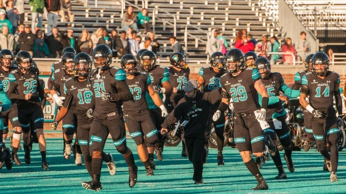 The Coastal Carolina football team takes the field prior to a game this past season.