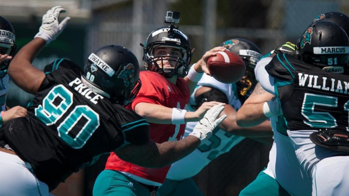 Coastal Carolina quarterback Tyler Keane (center) looks to throw during the Chants’ annual spring game Saturday at Brooks Stadium in Conway.