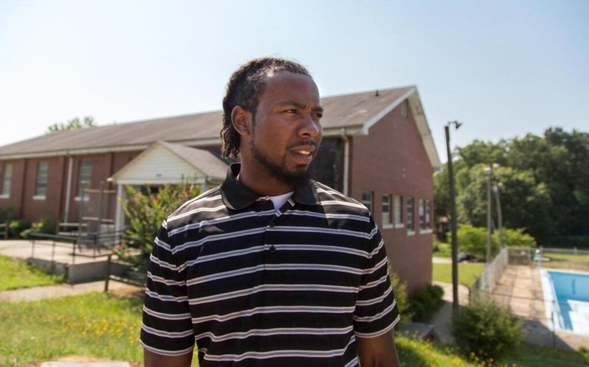 Josh Norman stands outside the now closed Seaboard Recreation Center where he used to play as a kid in Greenwood.