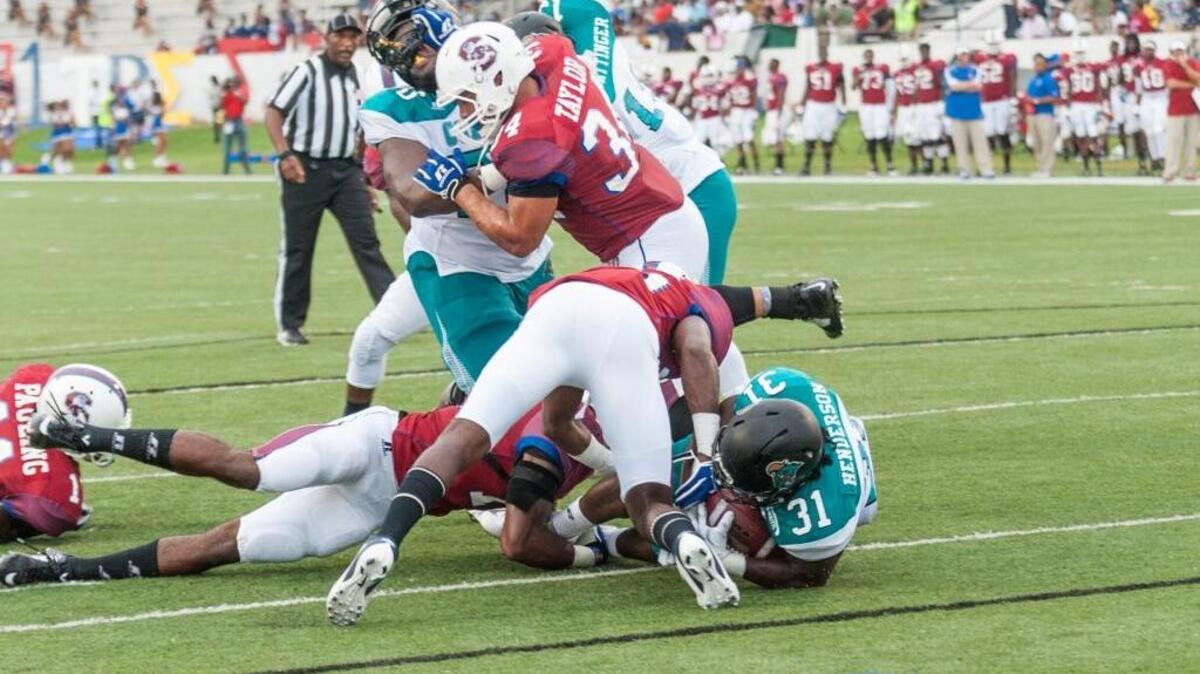 
Coastal Carolina running back De’Angelo Henderson (31) gets into the end zone against South Carolina State on Saturday.
