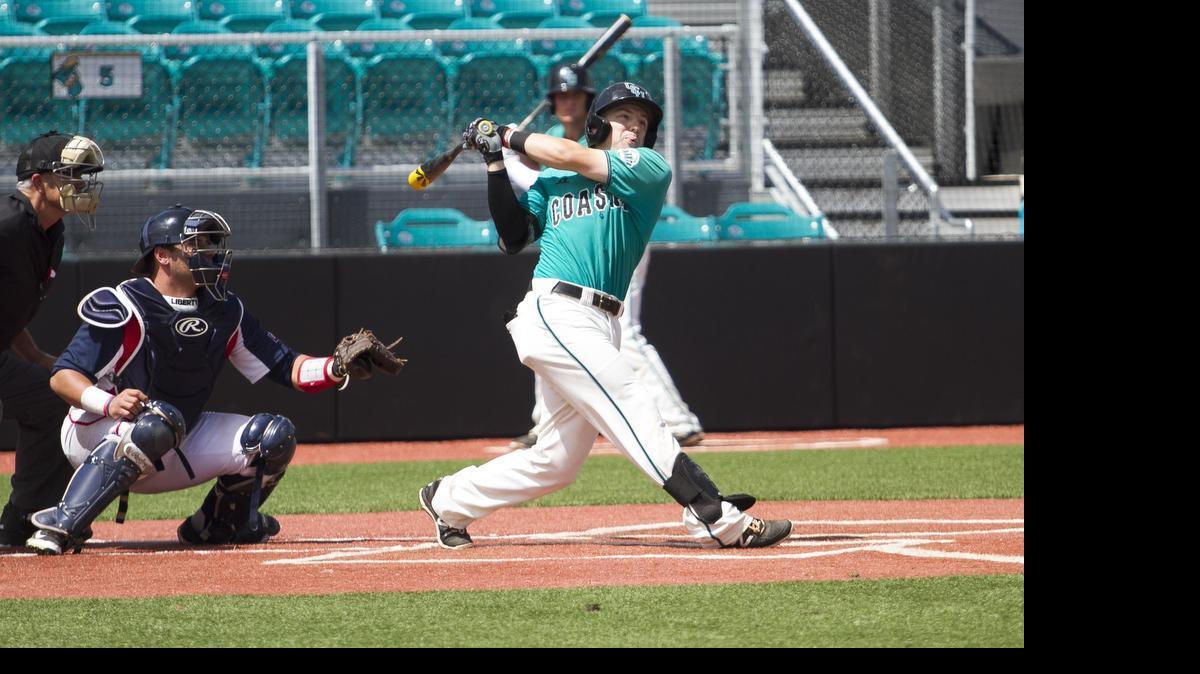 
Connor Owings hits his first of two home runs in the game against Liberty Saturday. Despite numerous rain delays from Tropical Storm Ana, the pivotal Coastal Carolina vs. Liberty series was played at CCU.
