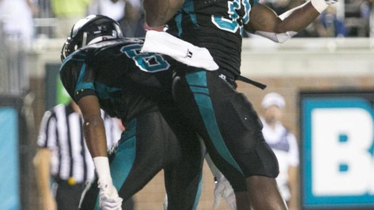 Celebrating in the end zone has become a regular occurrence for Coastal Carolina running back De’Angelo Henderson, who is one trip to the end zone away from setting a new FCS record for touchdowns in consecutive games.