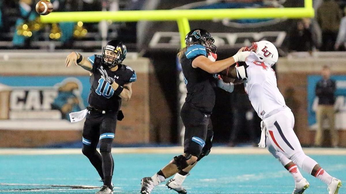 Coastal Carolina University's Tyler Chadwick passes in the game with Liberty University on Thursday, Nov. 17.