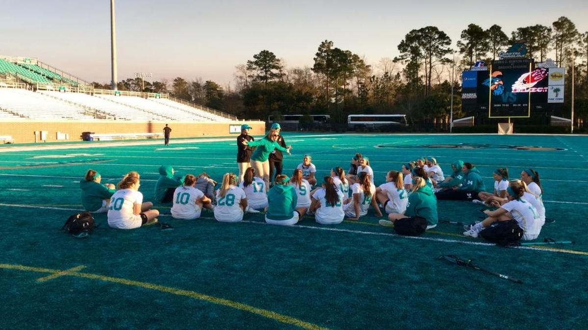 Coastal Carolina women’s lacrosse coach Kristen Selvage talks to her team after a loss to Elon in 2016 at Brooks Stadium.