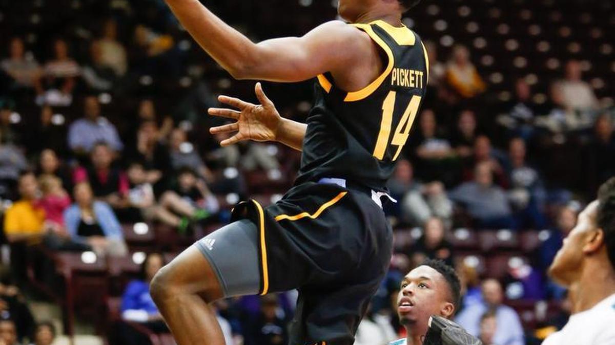 Winthrop's #14 Adam Pickett glides to the basket as Winthrop hosts Coastal Carolina Thursday 2-18-2016.