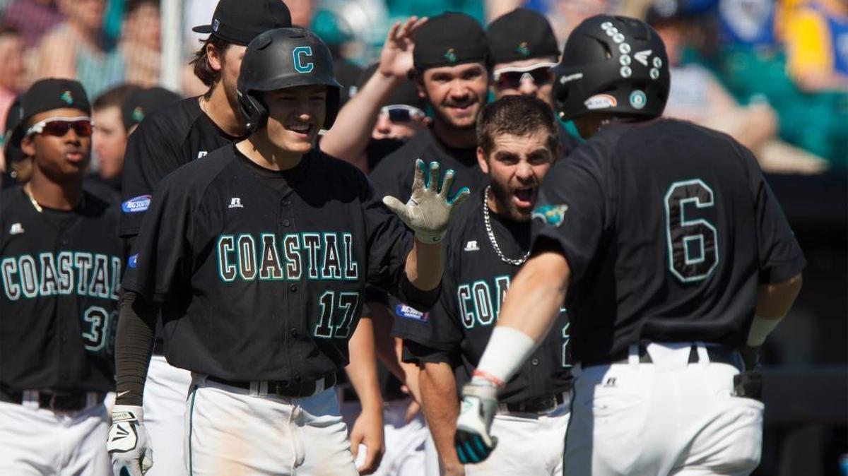 Coastal Carolina players welcome Connor Owings (6) back to the dugout his two-run home run against Gardner-Webb on Sunday.